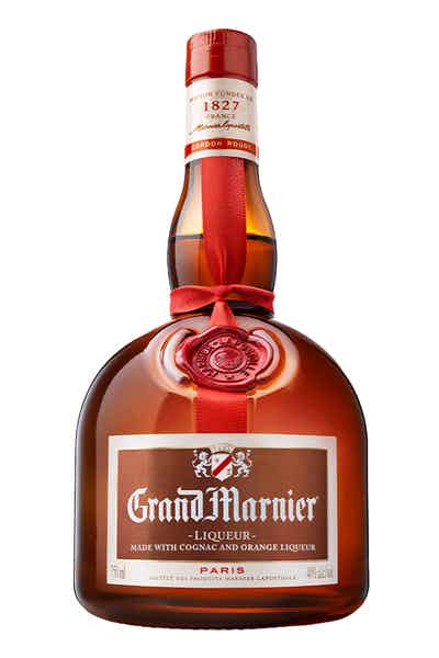 A bottle of Grand Marnier Cordon Rouge Orange Liqueur with a red ribbon wrapped around it, showcasing the brand&